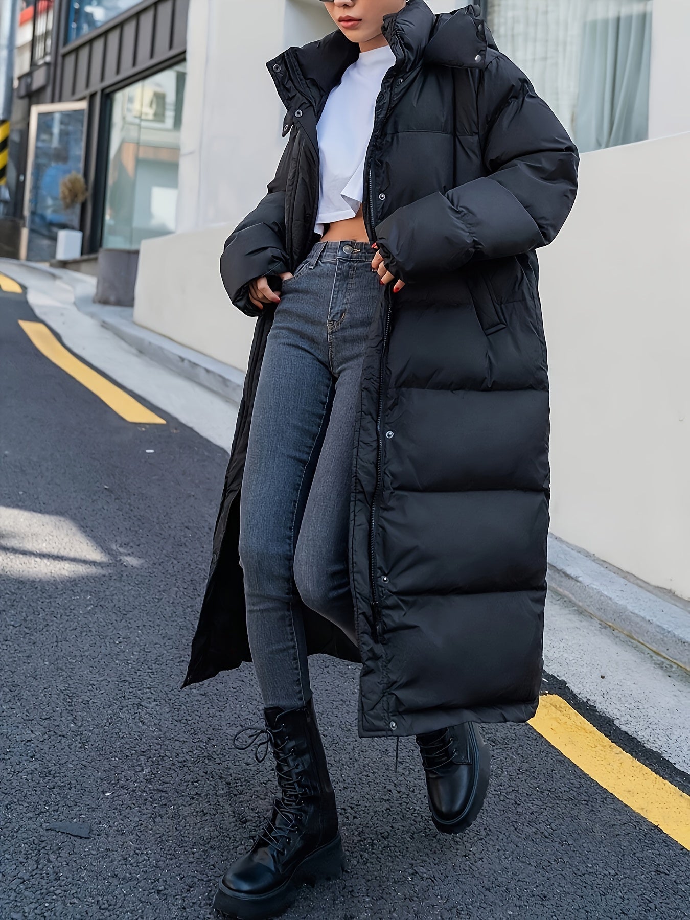 Women's Long Black Puffer Jacket with Hood and Full-Length Quilted Design